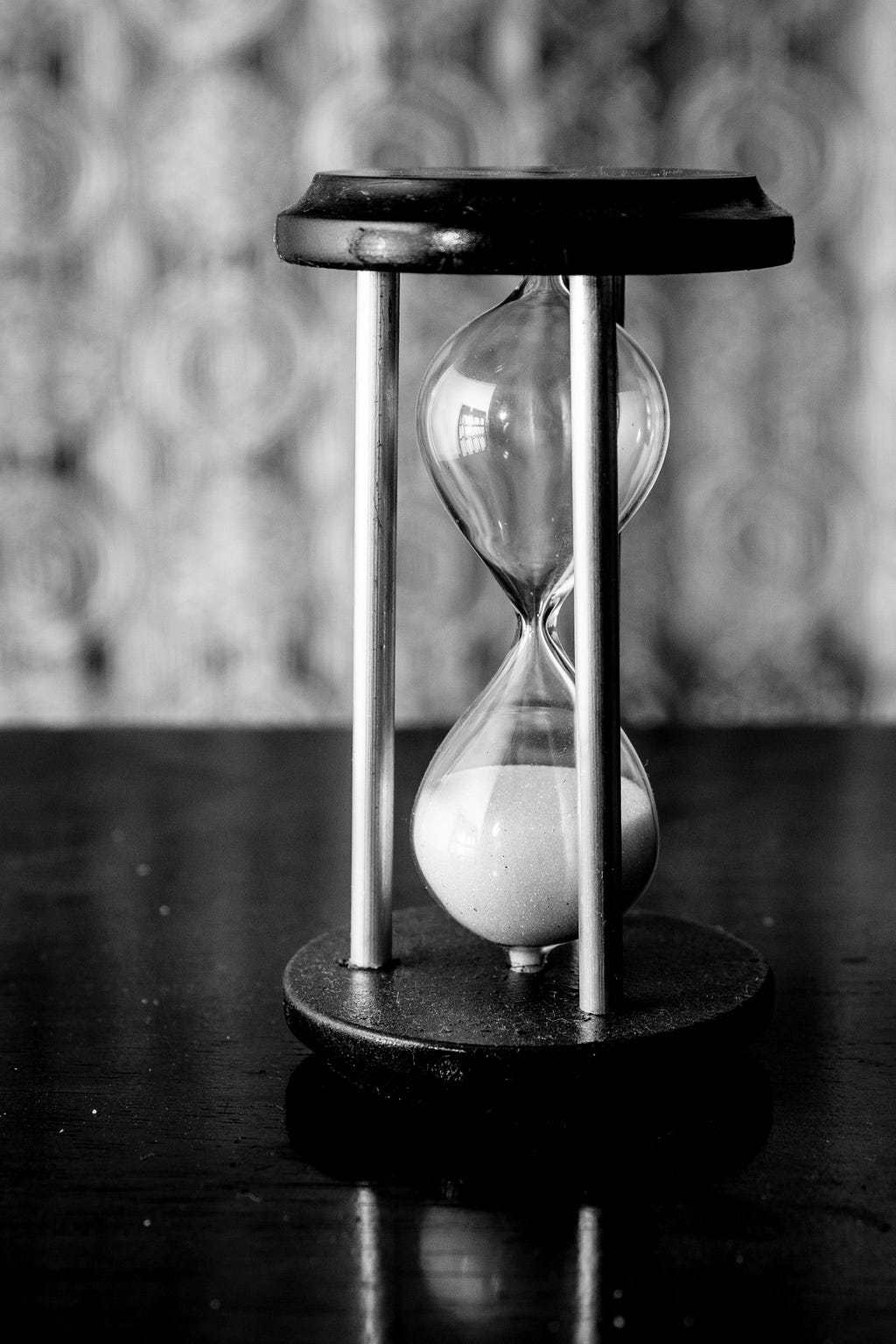An hourglass with all the sand at the bottom — time’s up!