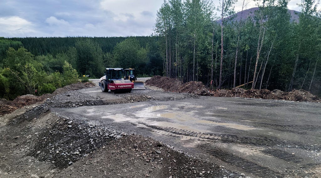 construction vehicles preparing a road