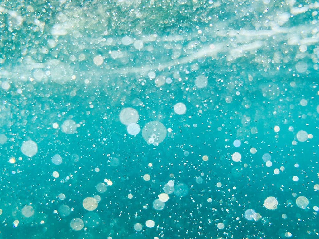 Close-up of Water Bubbles Splashing in A Pool or Sea