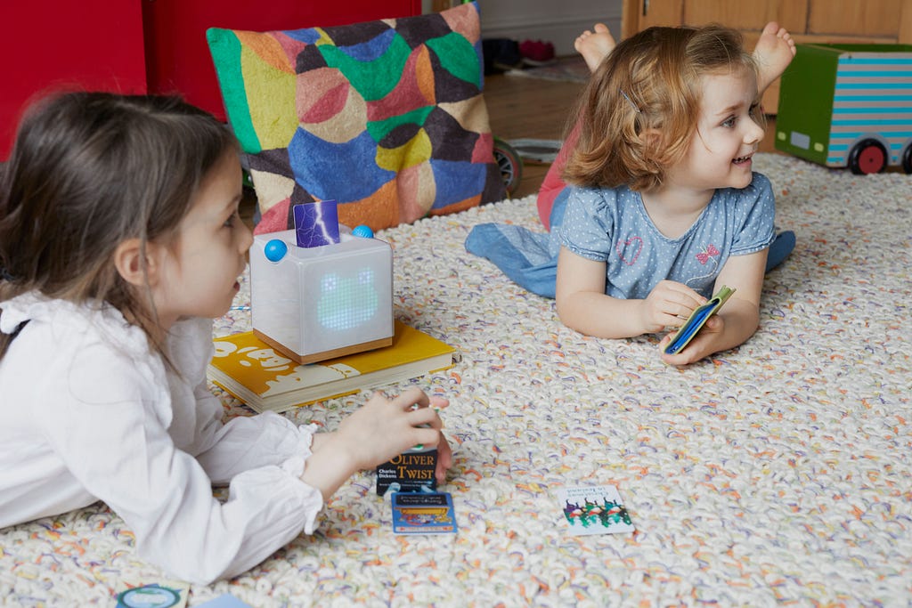 Two children listen to podcasts on Yoto, the screen-free audio platform