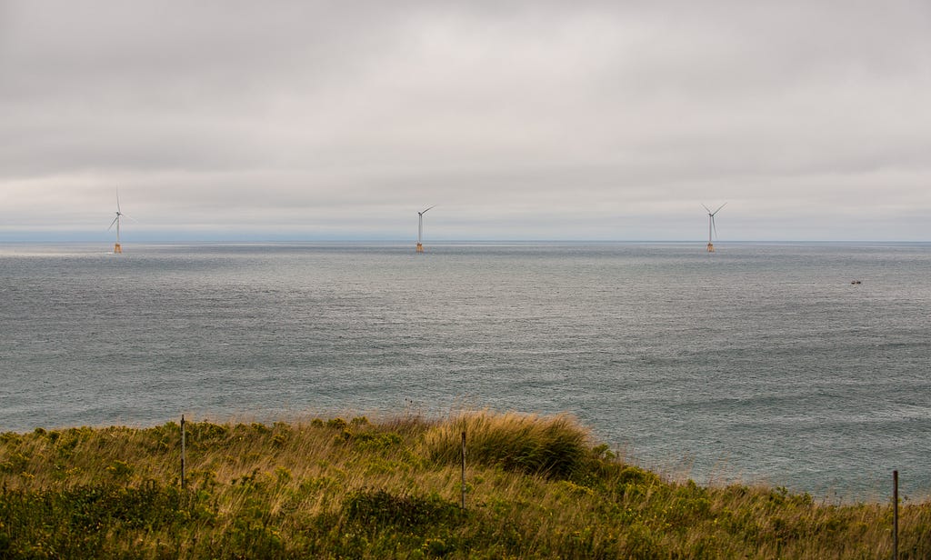 A view of offshore wind turbines from land