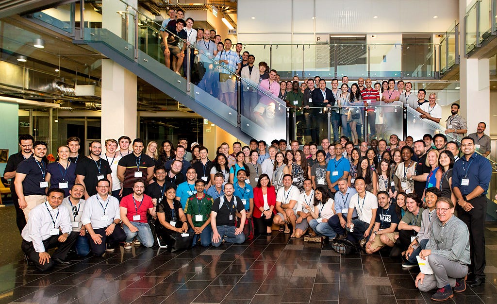 Group photo of more than 100 adults wearing nametags.