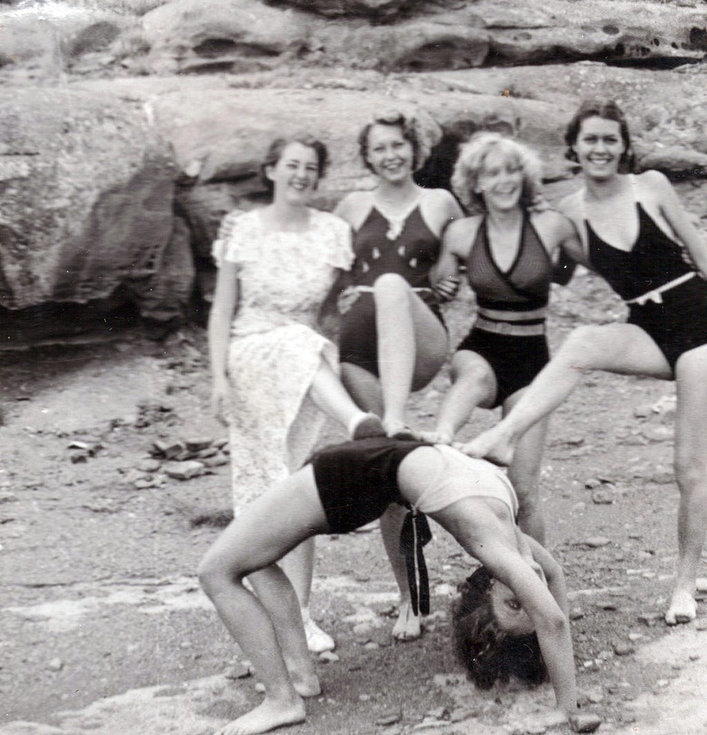 Five swimsuit-clad women goof around for the camera near Winslow, Arizona.