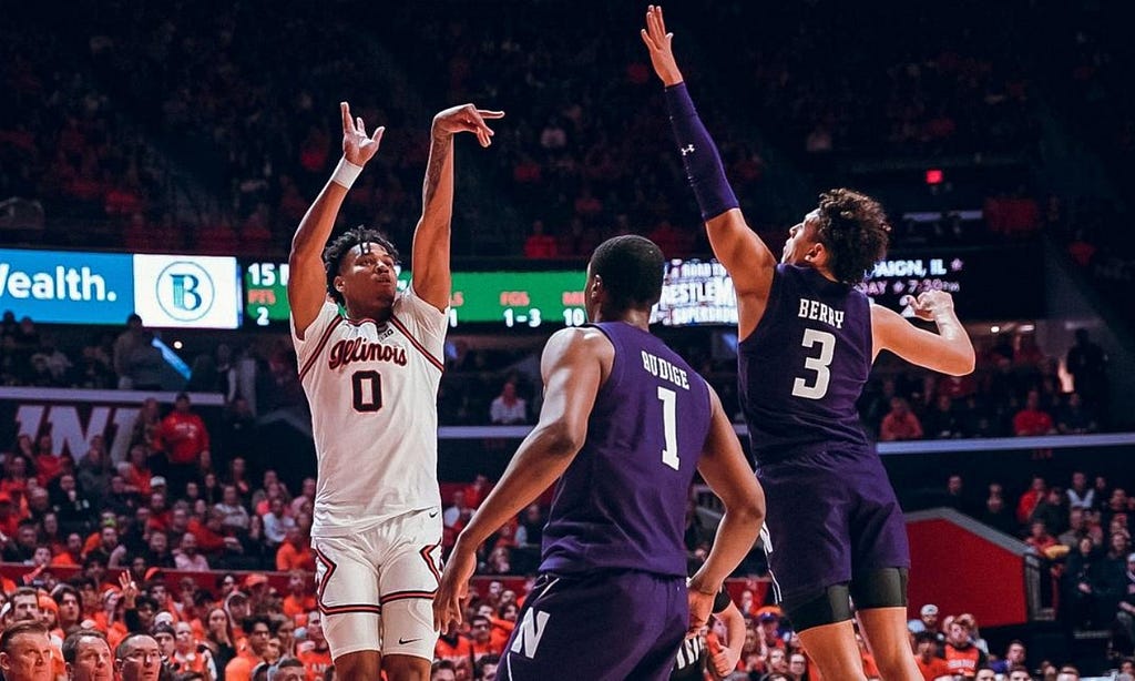 Terrence Shannon releases a jumper over two Northwestern defenders.