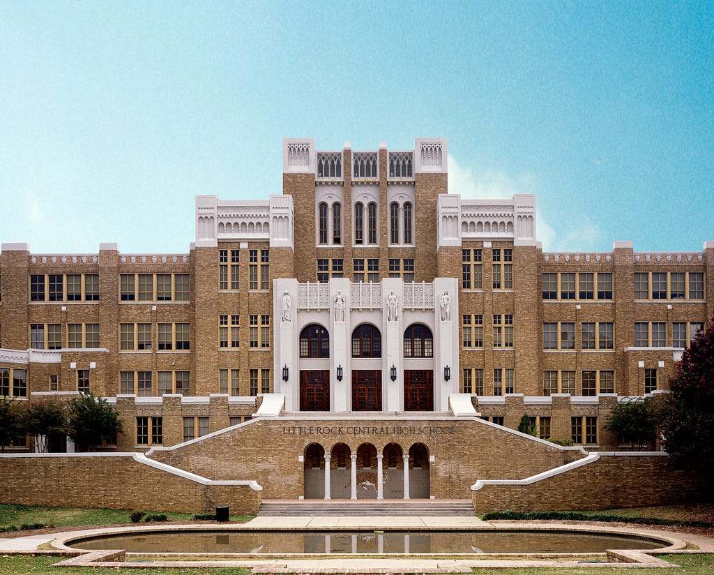 Head-on shot of a symmetrical school building showing that the design rule of thirds can be applied to photography as well.