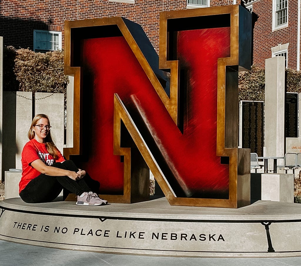 Me posing in front of the UNL Alumni “N” statue, November 2020