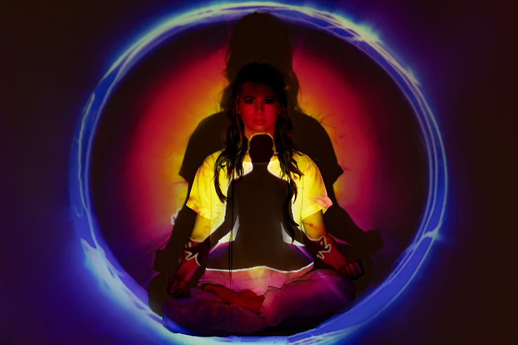 Woman in meditation pose with peculiar lighting