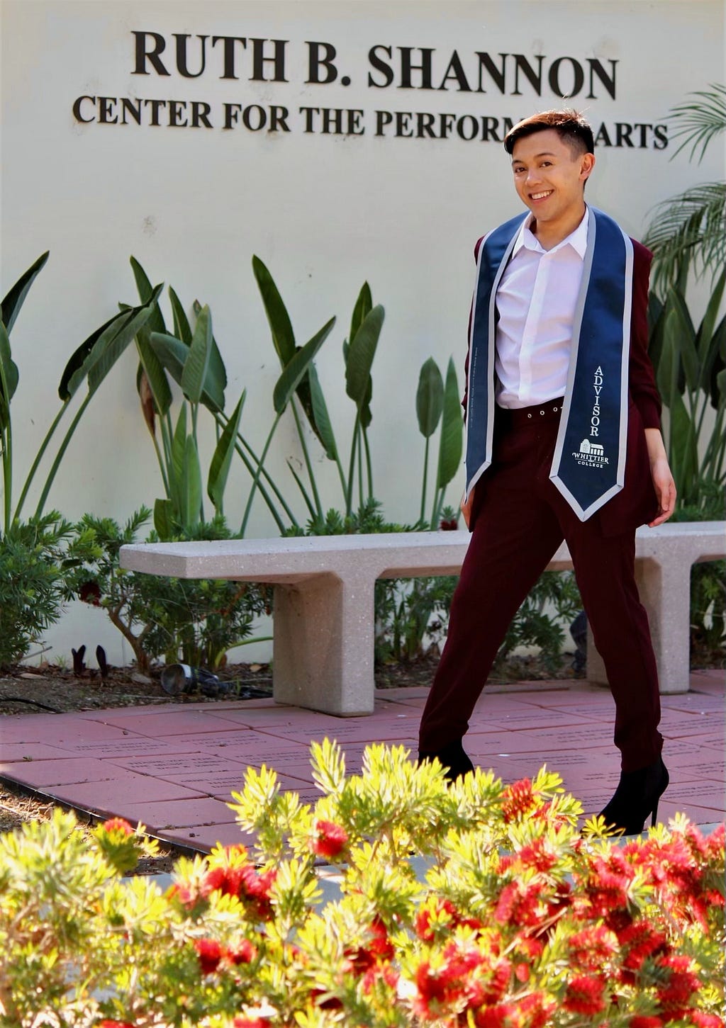 Gabriel Gorospe wearing his Residential Advisor Stole outside of Whittier College’s Ruth B. Shannon Center for the Performing Arts.