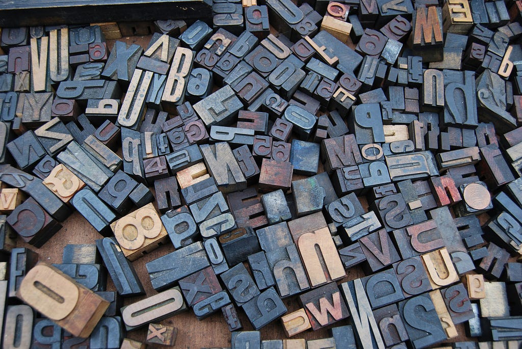 A bunch of vintage woodcut letters for letterpress printing.