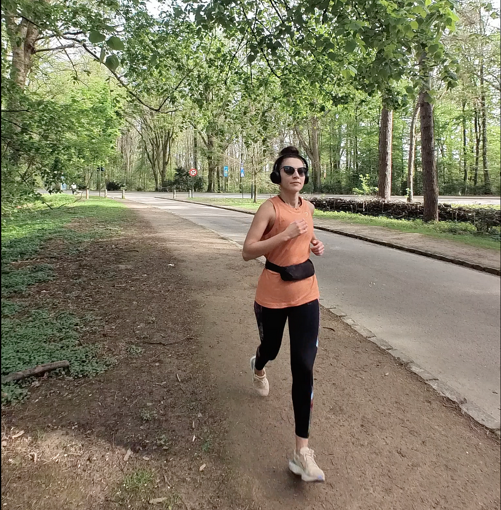 A woman running in the park “Bois de la Cambre” in Brussels