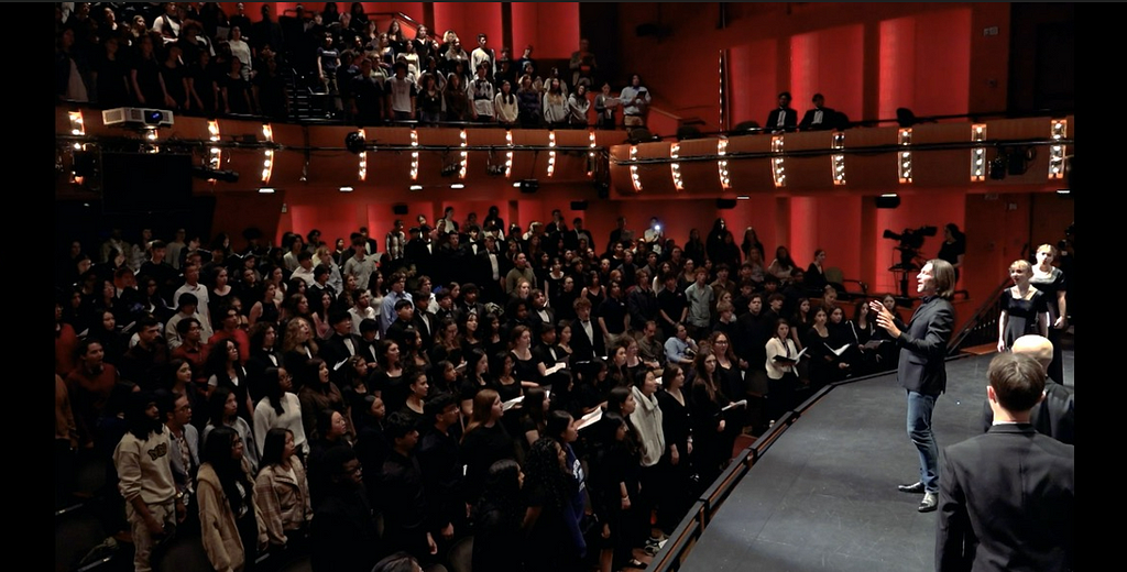 Eric Whitacre conducting the audience of Montclair State University during the Friday performance.