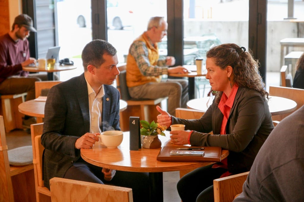 Secretary Buttigieg and Mayor Davis chat over coffee at Clyde Coffee