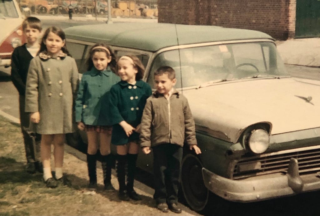 Familia Matiz in front of their first car in the U.S.