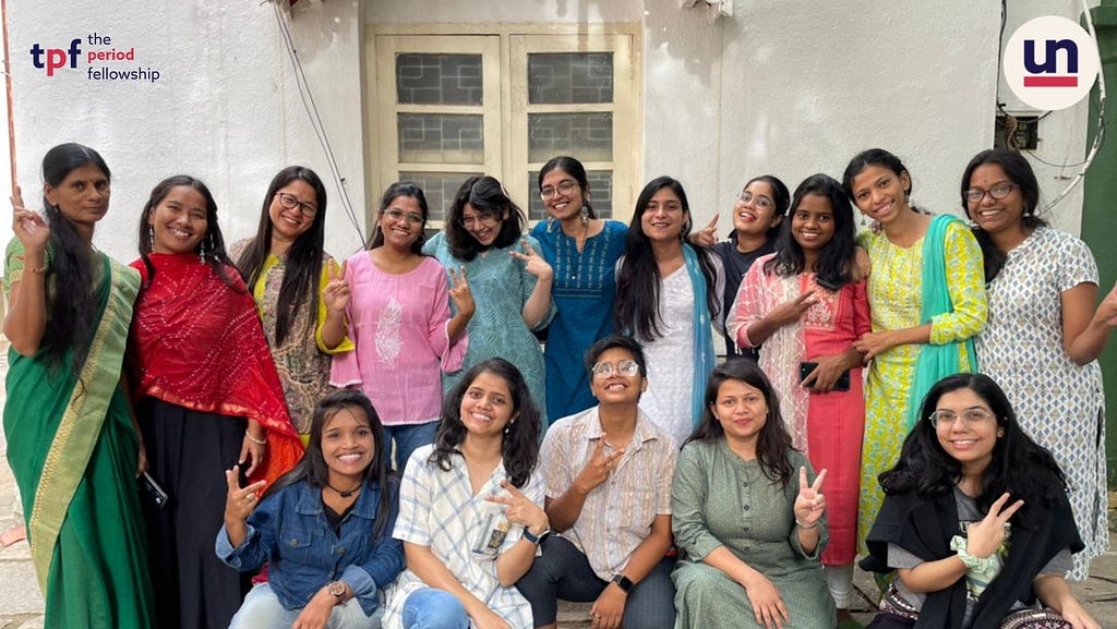 A group of young 16 young ladies — Uninhibited’s Period Fellowship Cohort of 2022–24 — standing together