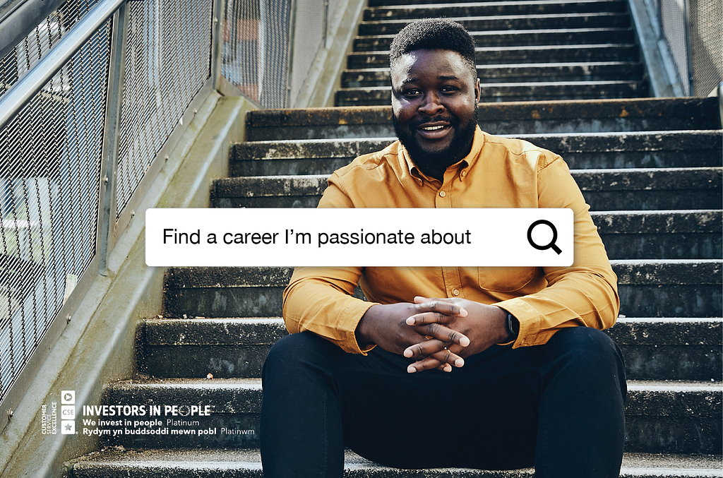 A man sitting on some stairs. A search bar shows the message ‘Find a career I’m passionate about’.