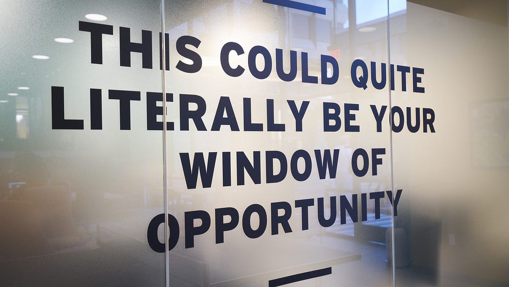 Office glass wall saying “This could quite literally be your windows of opportunity”