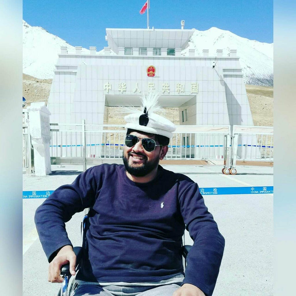 a young man in a wheelchair at the China-Pakistan border.