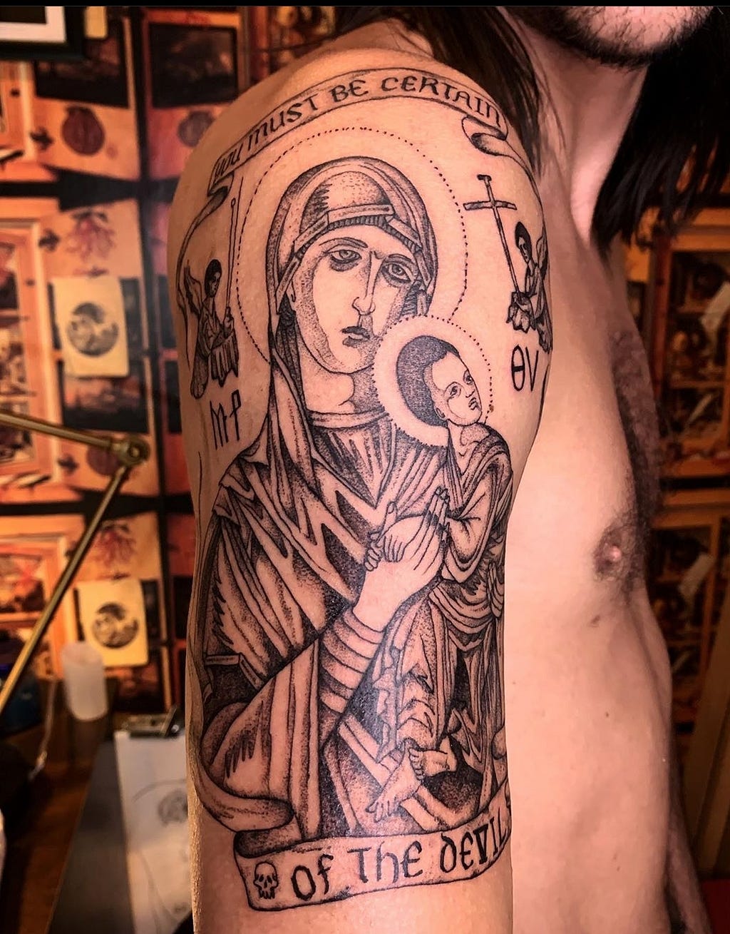 Tattoo of a Byzantine icon of the Mother & Child, surrounded by the phrase You Must Be Certain Of The Devil