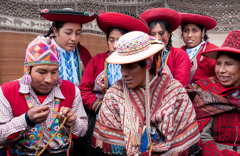 Quechuan weavers share their weaving insights at a Peru Weavers Awards held at the Centre for Traditional Textiles Away in Chinchero, Peru. (© April Orcutt. All Rights Reserved)