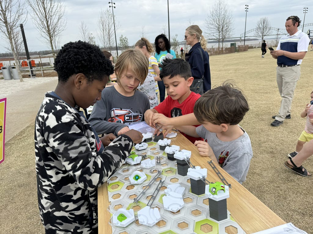 Students conducting a science experiment in Tom Lee Park