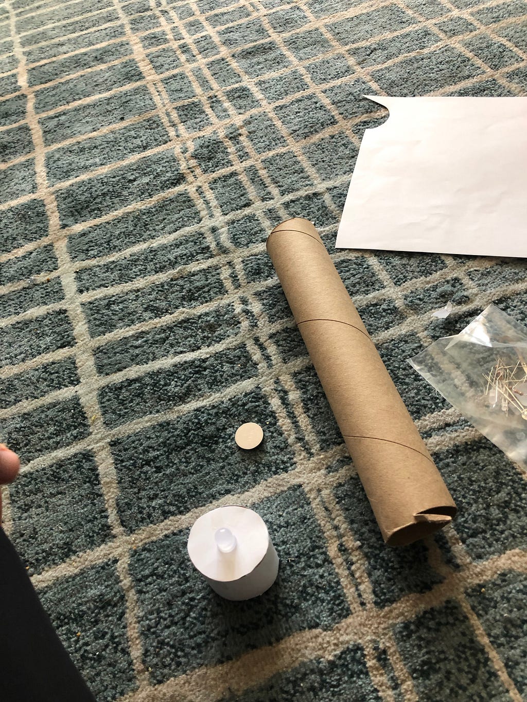 A picture of the paper, paper towel roll and LEDs I used to make a paper tea light enclosure.