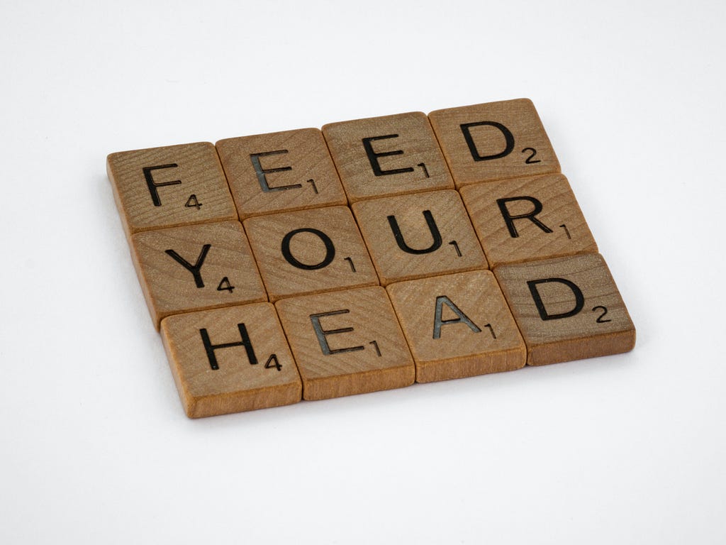 Picture showing scrabble stones spelling the text ‘feed your head’