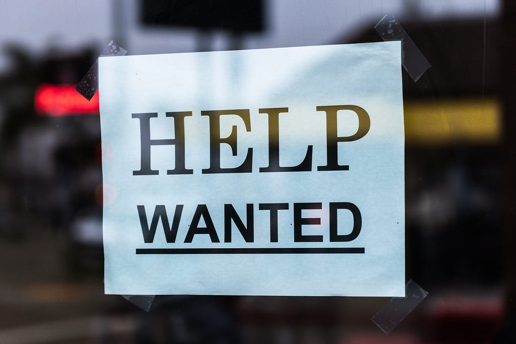 A paper sign saying ‘Help Wanted’