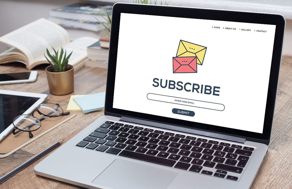 Laptop showing a newsletter subscribe button