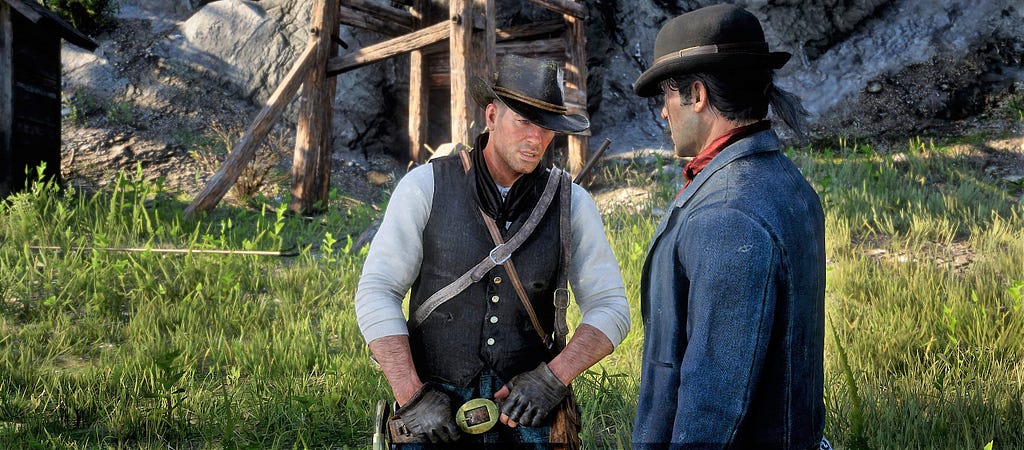 Arthur engaging in conversation with one of his gang’s members