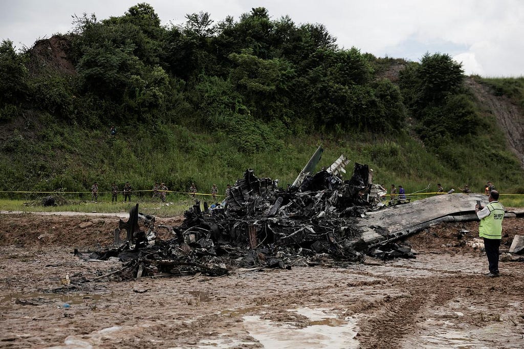 Debris of recently crashed Bombardier CRJ200 model aircraft of Saurya Airlines at Tribhuvan International Airport