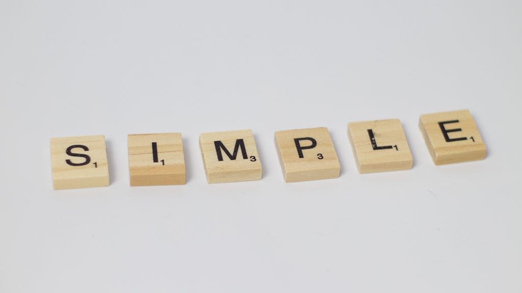 Scrabble tiles spell the word “simple.”