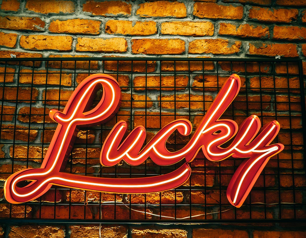 a ‘luck’ neon sign to represent luck in an ukay-ukay business