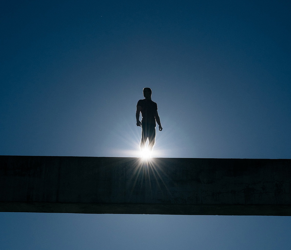 man standing on beam