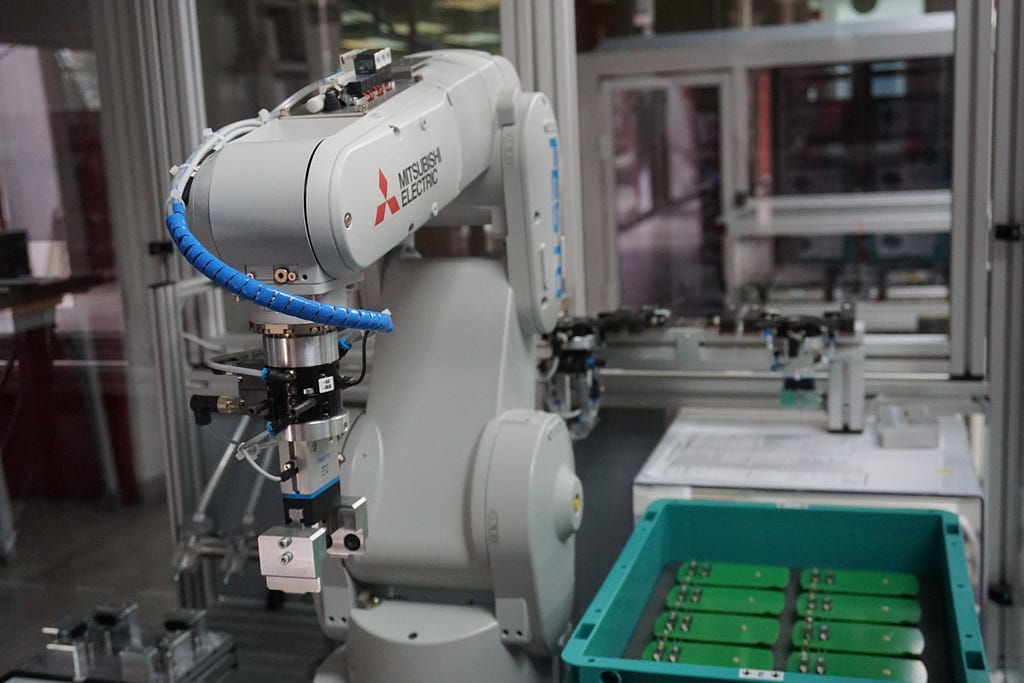 A robotic hand by Mitsubishi Electric is performing autonomous work.