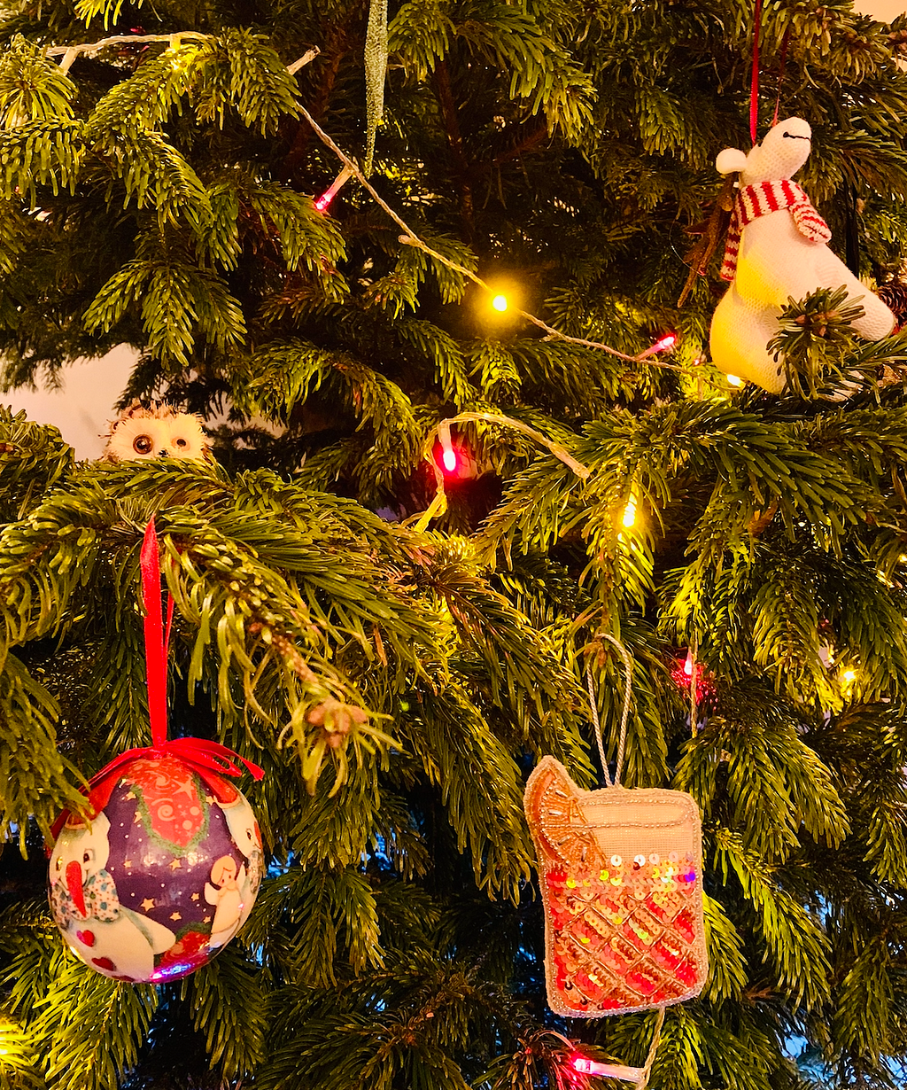 A Christmas tree extreme close-up with various baubles