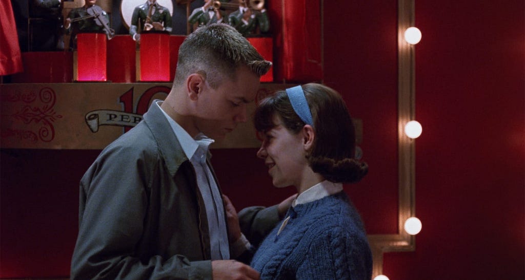 River Phoenix and Lili Taylor dancing together in a still from the film “Dogfight.”