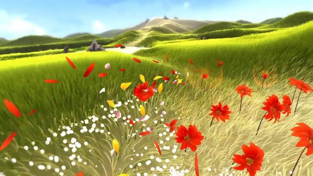 A beautiful field with red and yellow flowers, and a small cluster of flower petals whirling in the wind