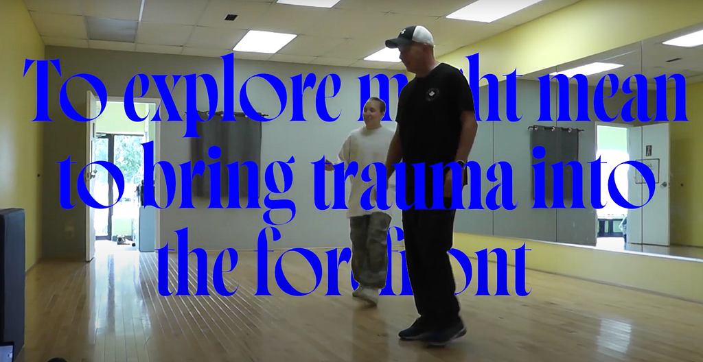 A film still that reads “to explore might mean to bring trauma into the forefront” with the researcher and her father in the dance studio in the background.