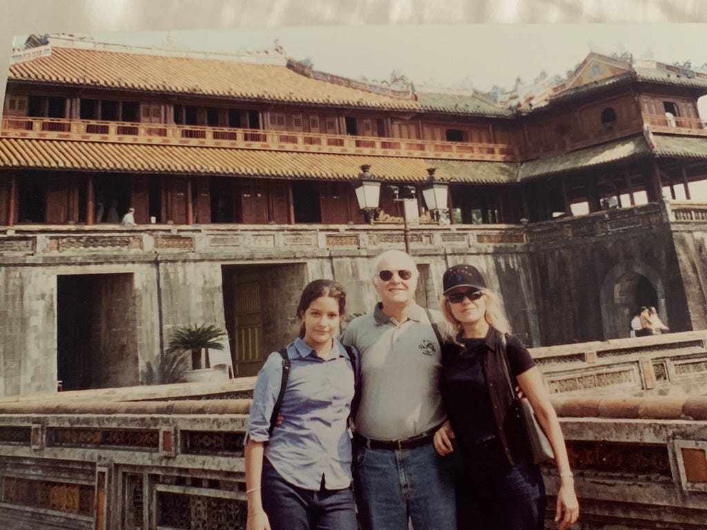 Monica and her parents in Vietnam