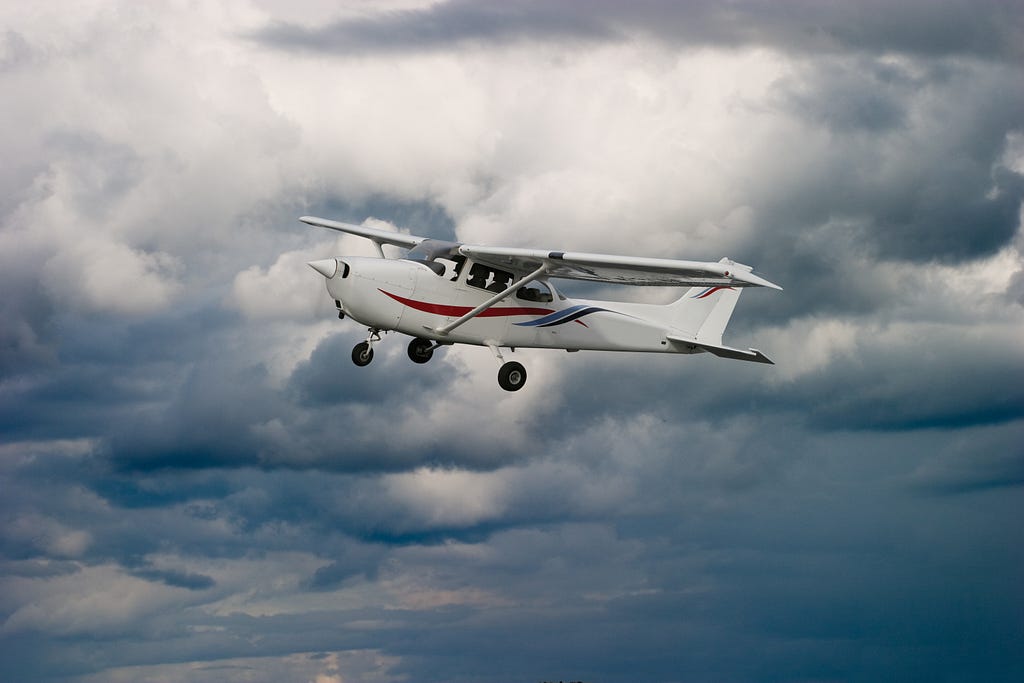 Stock image of a Cessna in flight.