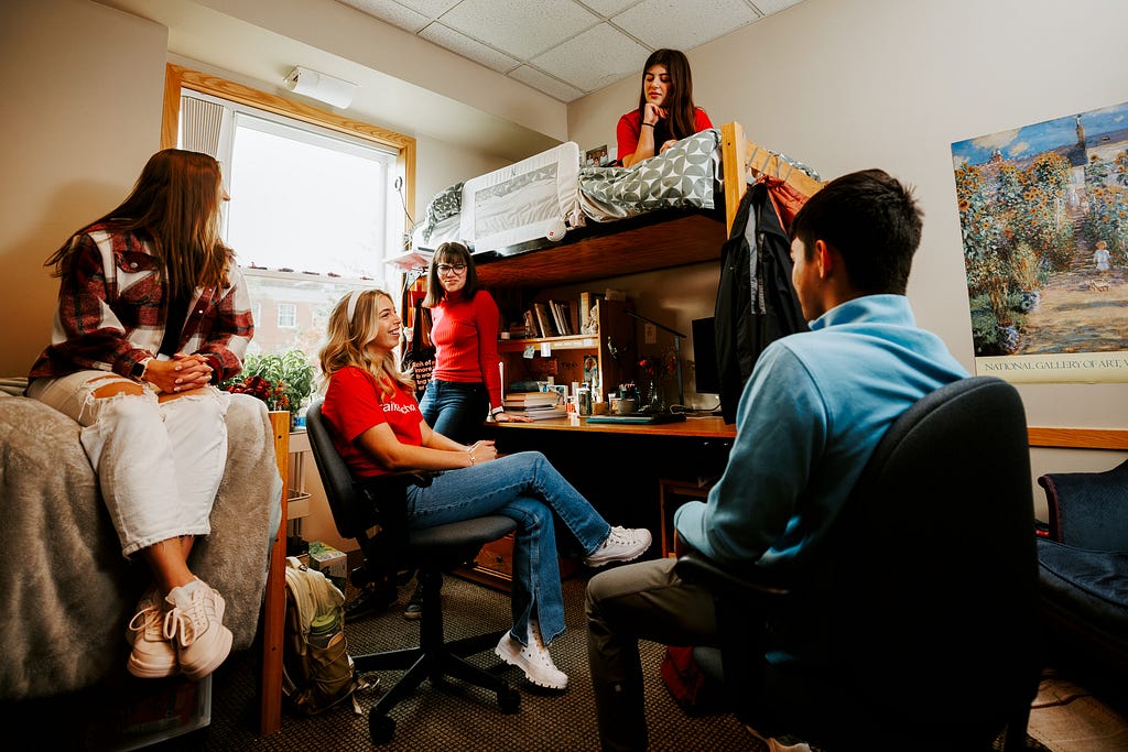 Students hangout together in a Kauffman Academic Center dorm room.