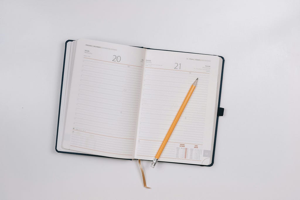 Pencil on open notebook