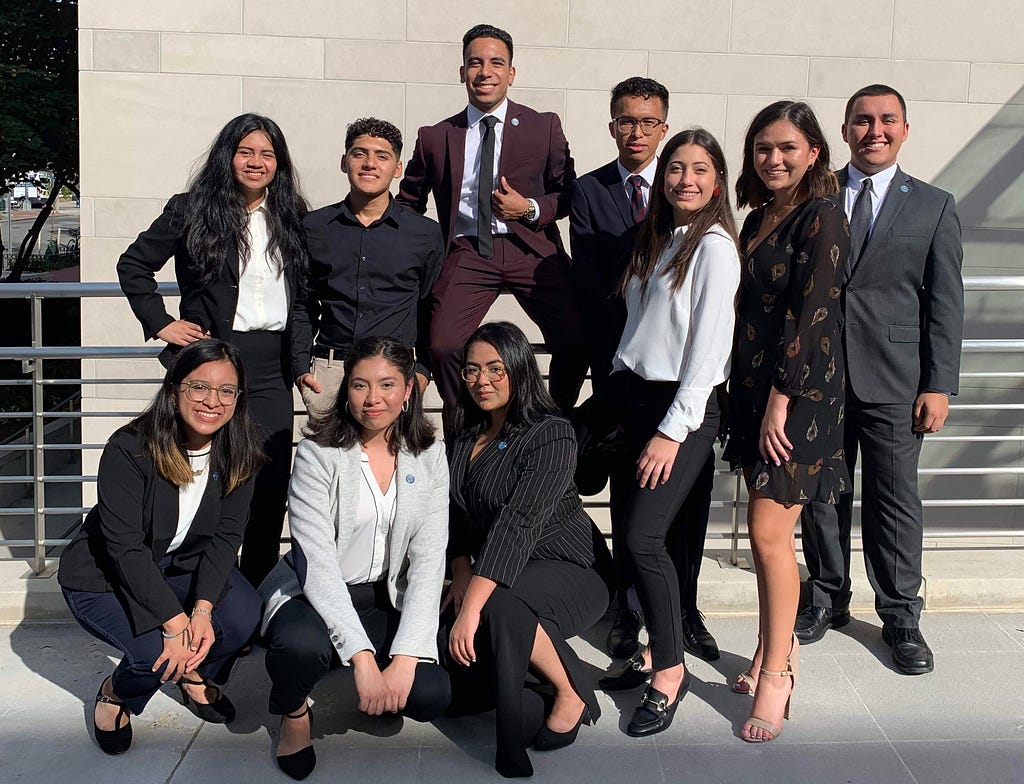 Group of Cisneros Scholars posing in front of Charles E. Smith Center.