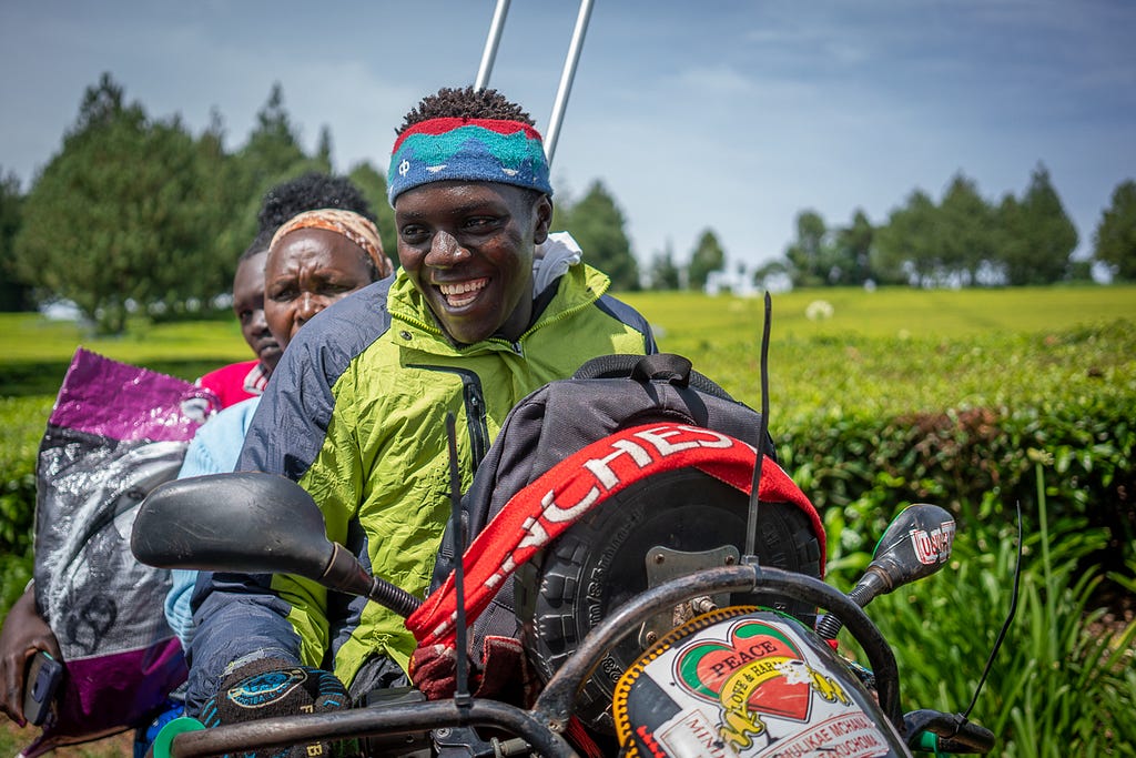 Three persons on a motorbike.