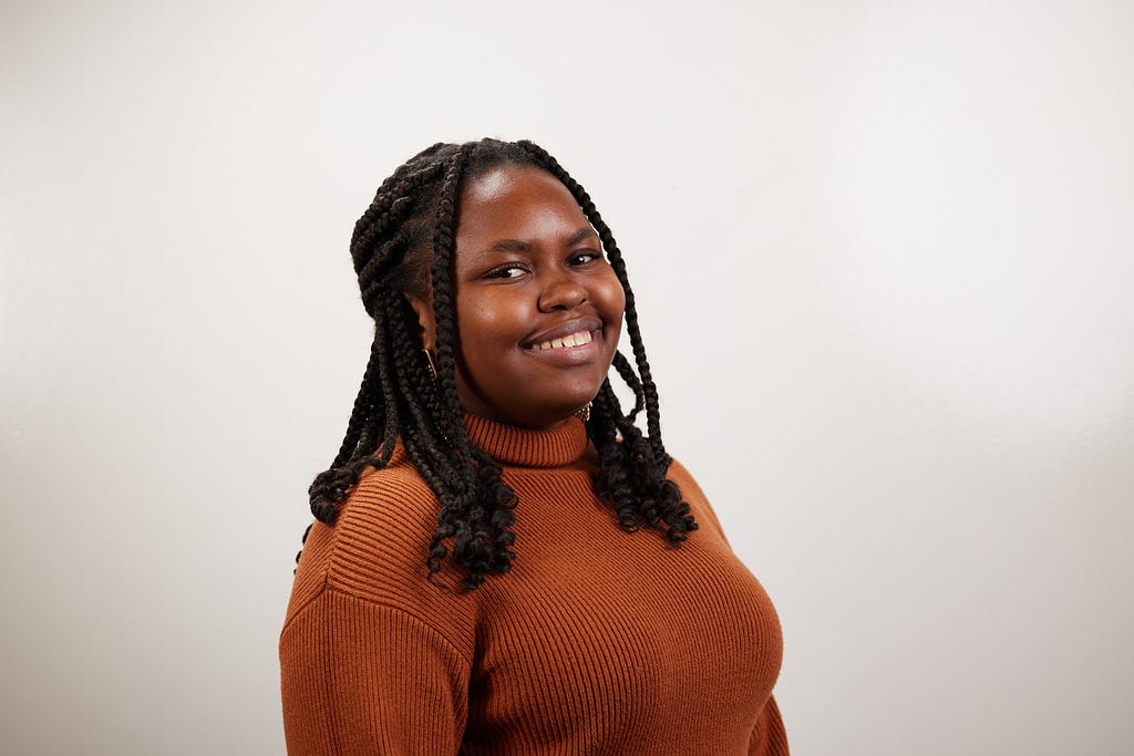 Harnaljia Fenelon smiles at the camera.