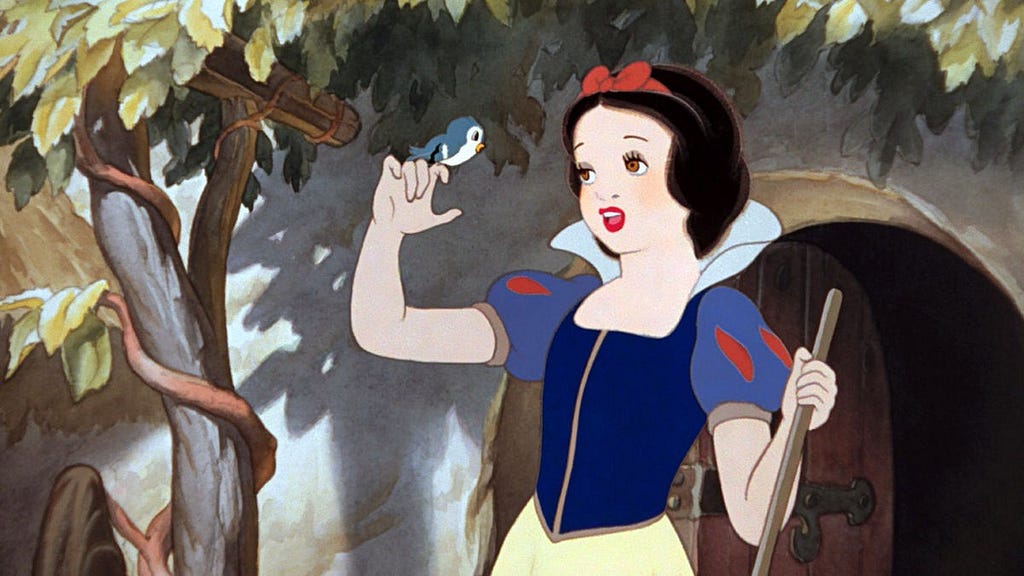 The fairest of them all, Snow White, singing to a little bird.