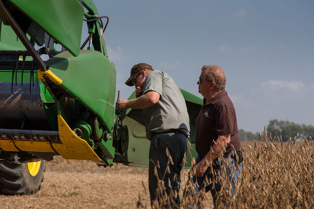 combine repair, courtesy of United Soybean Board