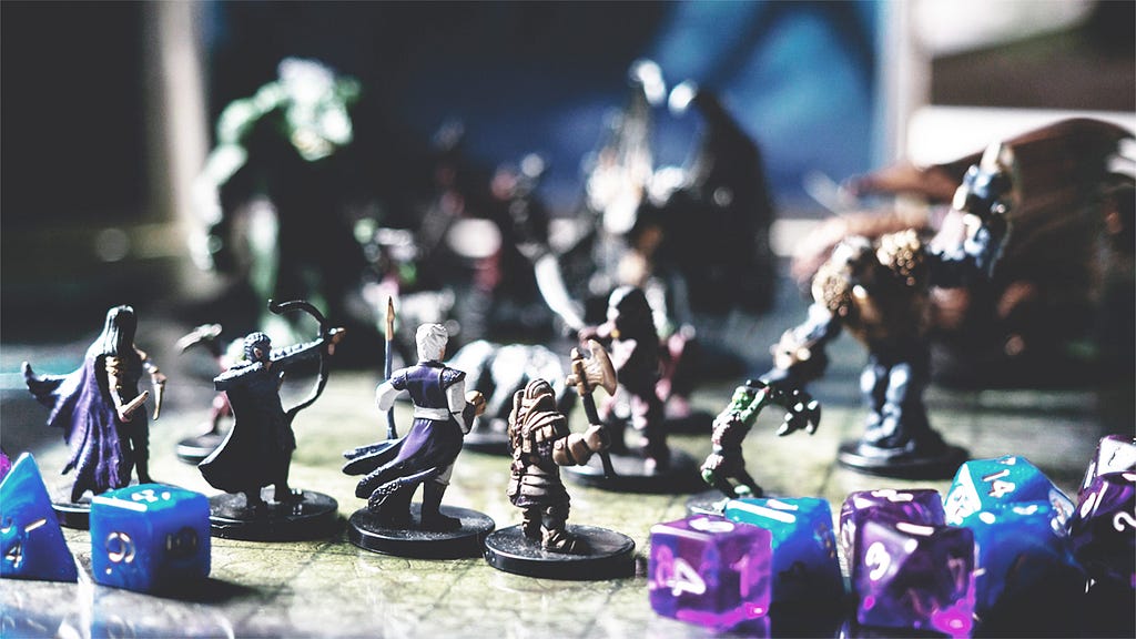 Character miniatures facing various monster figurines in battle, surrounded by dice.