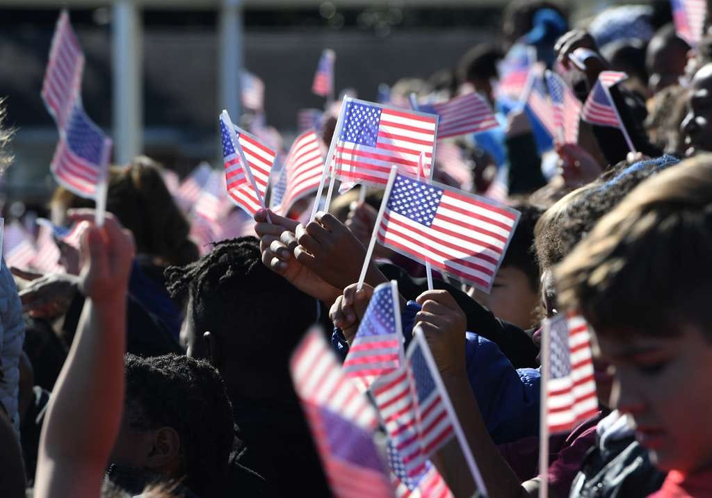 Students waving the USA flags.