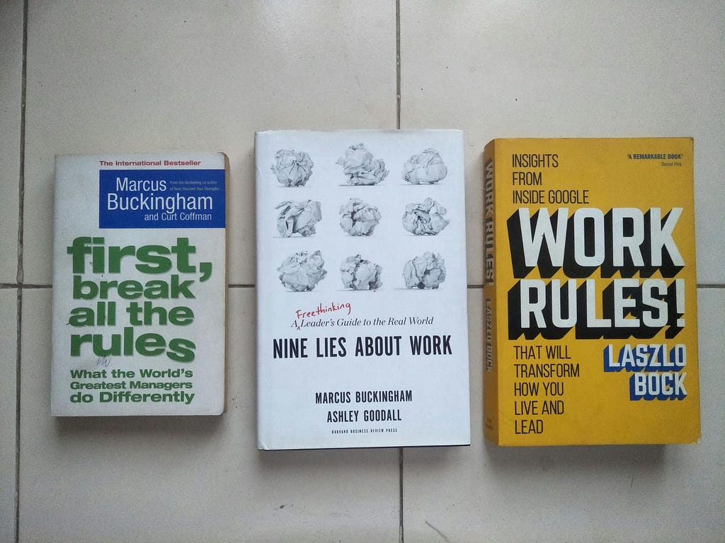 Photo featuring 3 management books — First break all the rules, Nine lies about work, and Work Rules